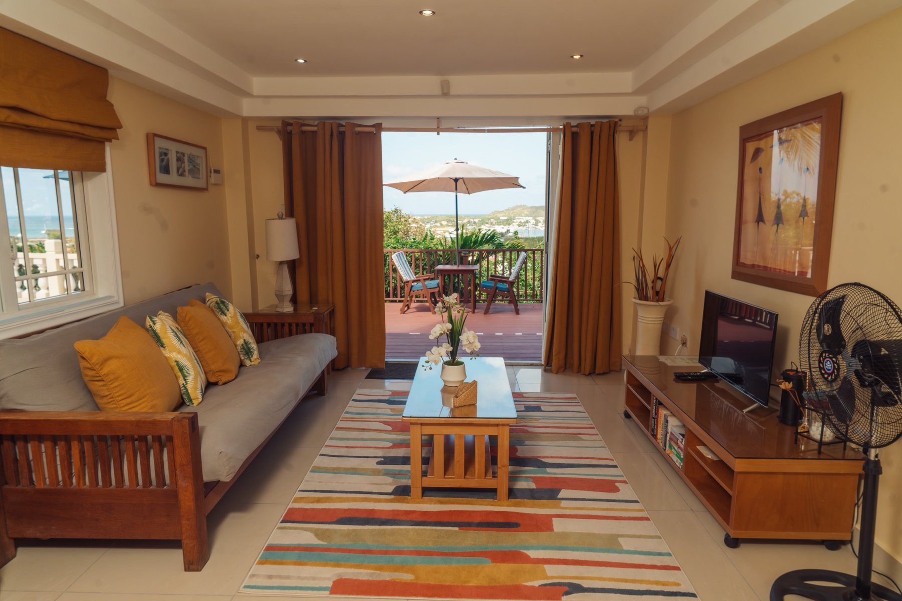 Rodney Bay Suites living room opening onto private terrace